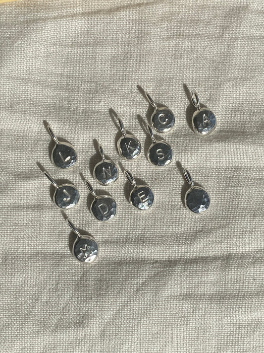 Handmade initial stamped necklace made from recycled sterling silver with hand stamped personalisation