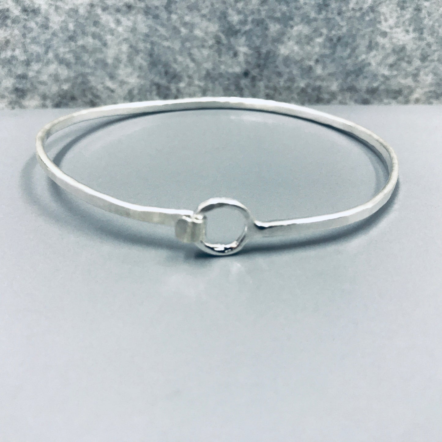 Sterling silver Oval shaped bangle with O clasp