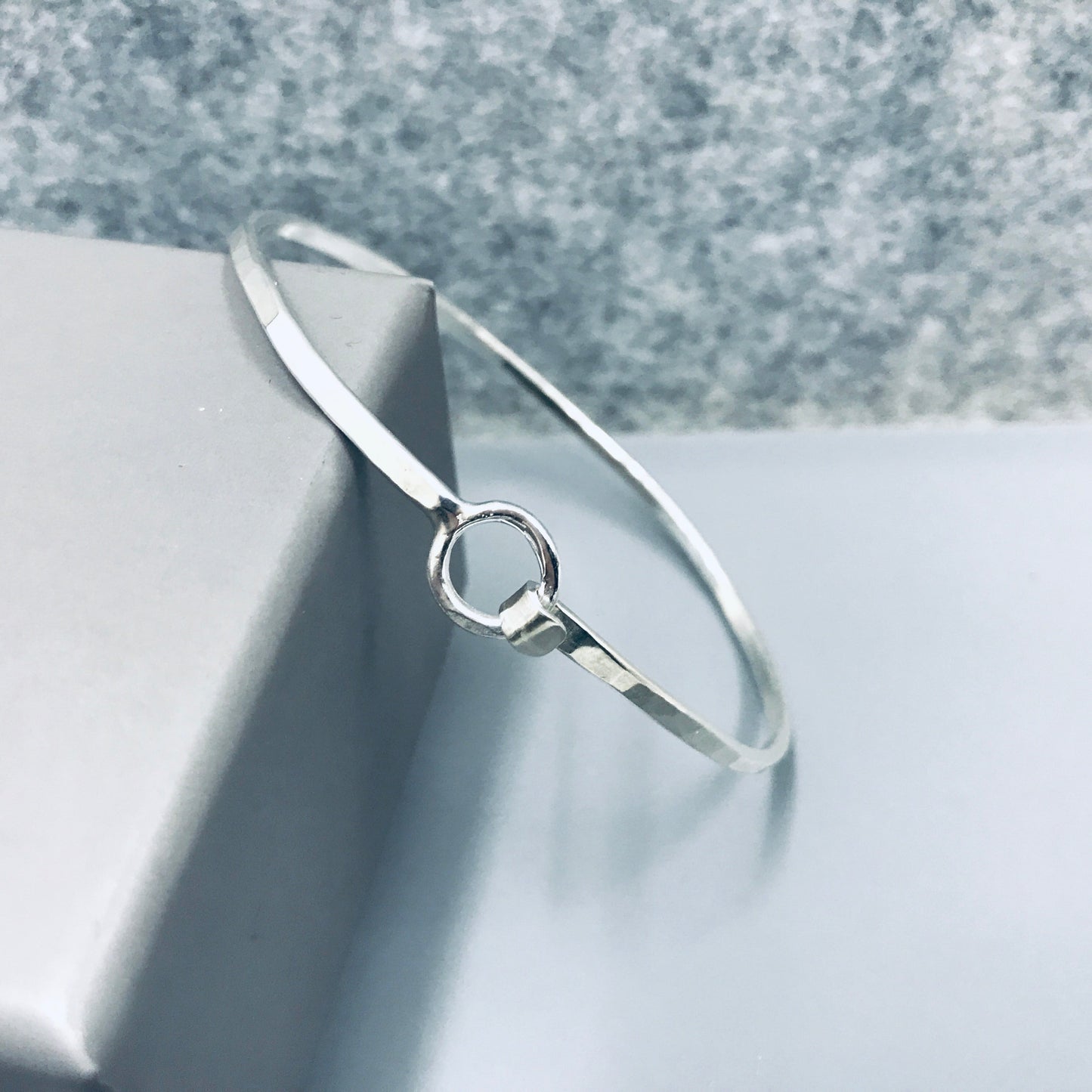 Sterling silver Oval shaped bangle with O clasp NM47