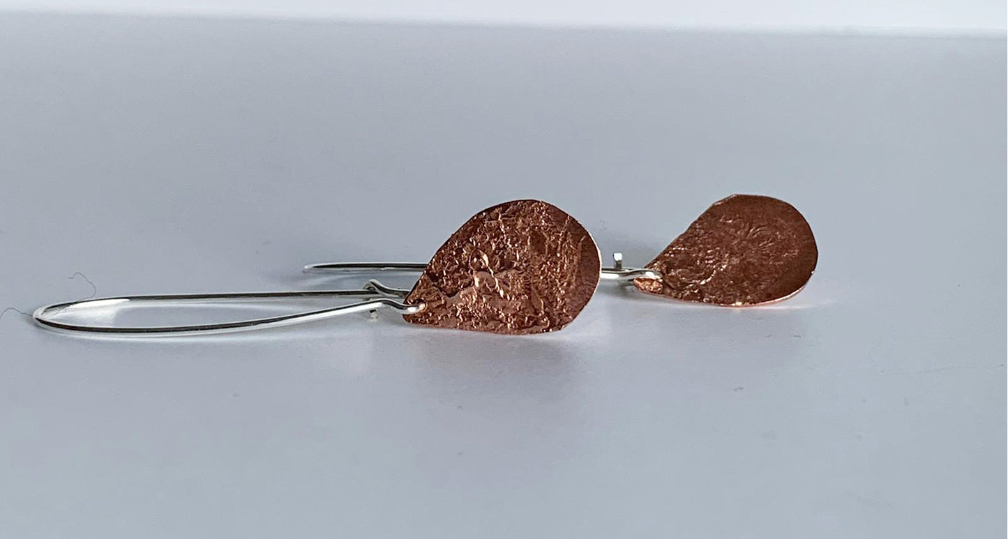 Silver earrings with reticulated copper drops