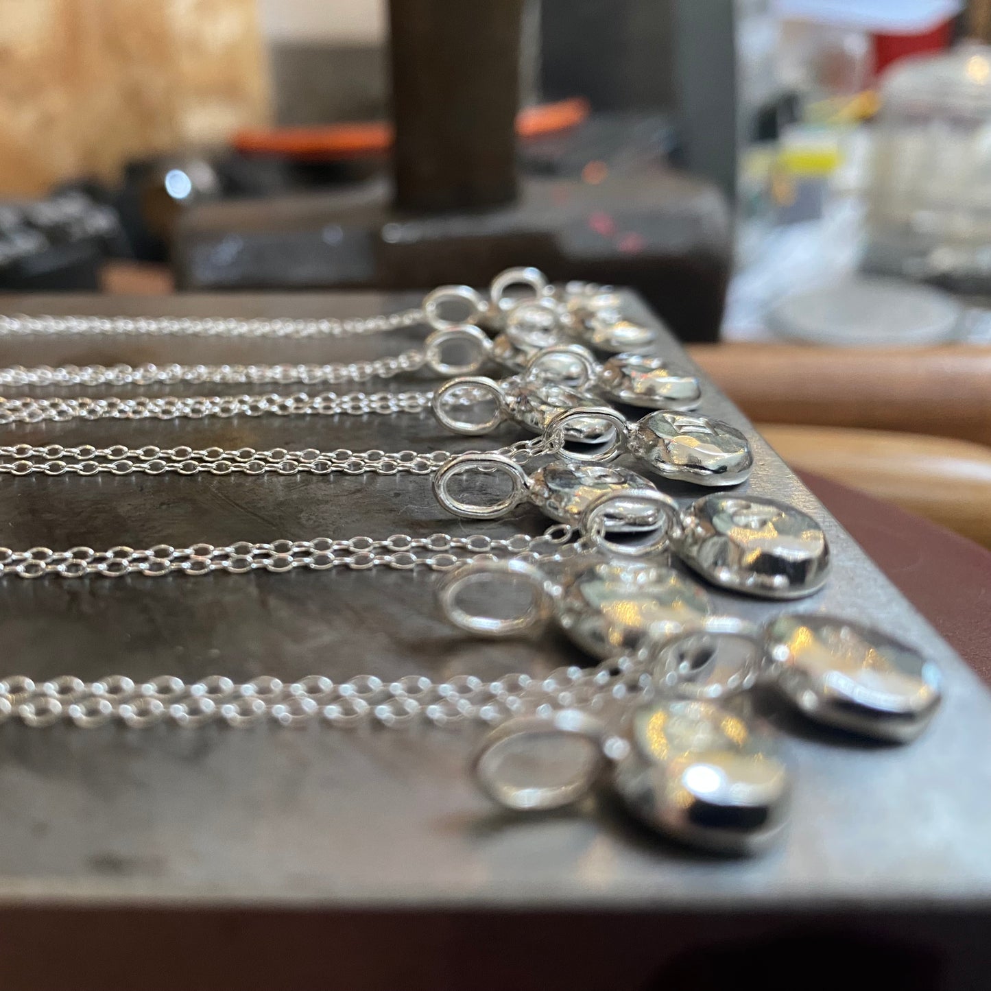 Handmade initial stamped necklace made from recycled sterling silver with hand stamped personalisation