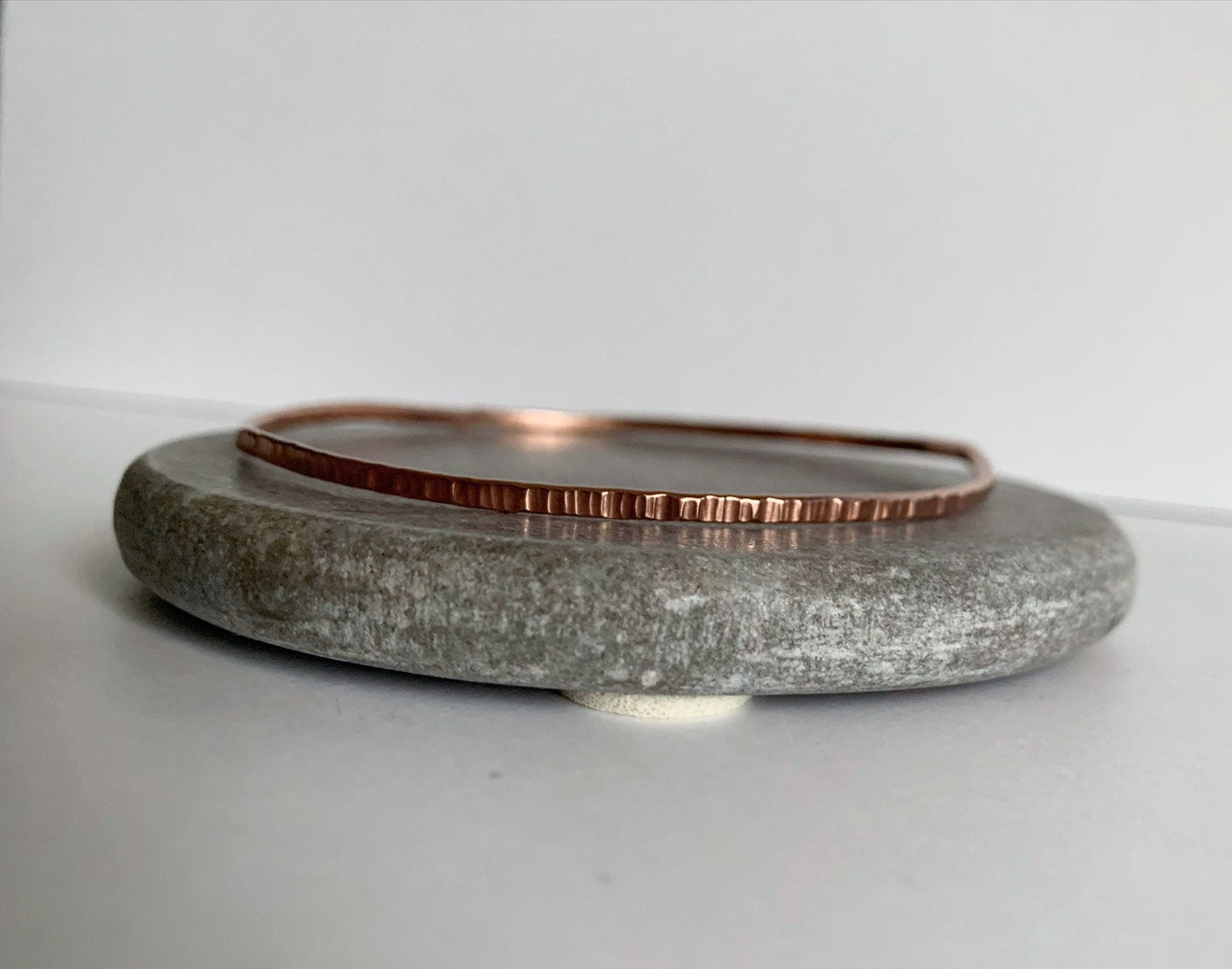 Copper bangle with heavy hammered texture