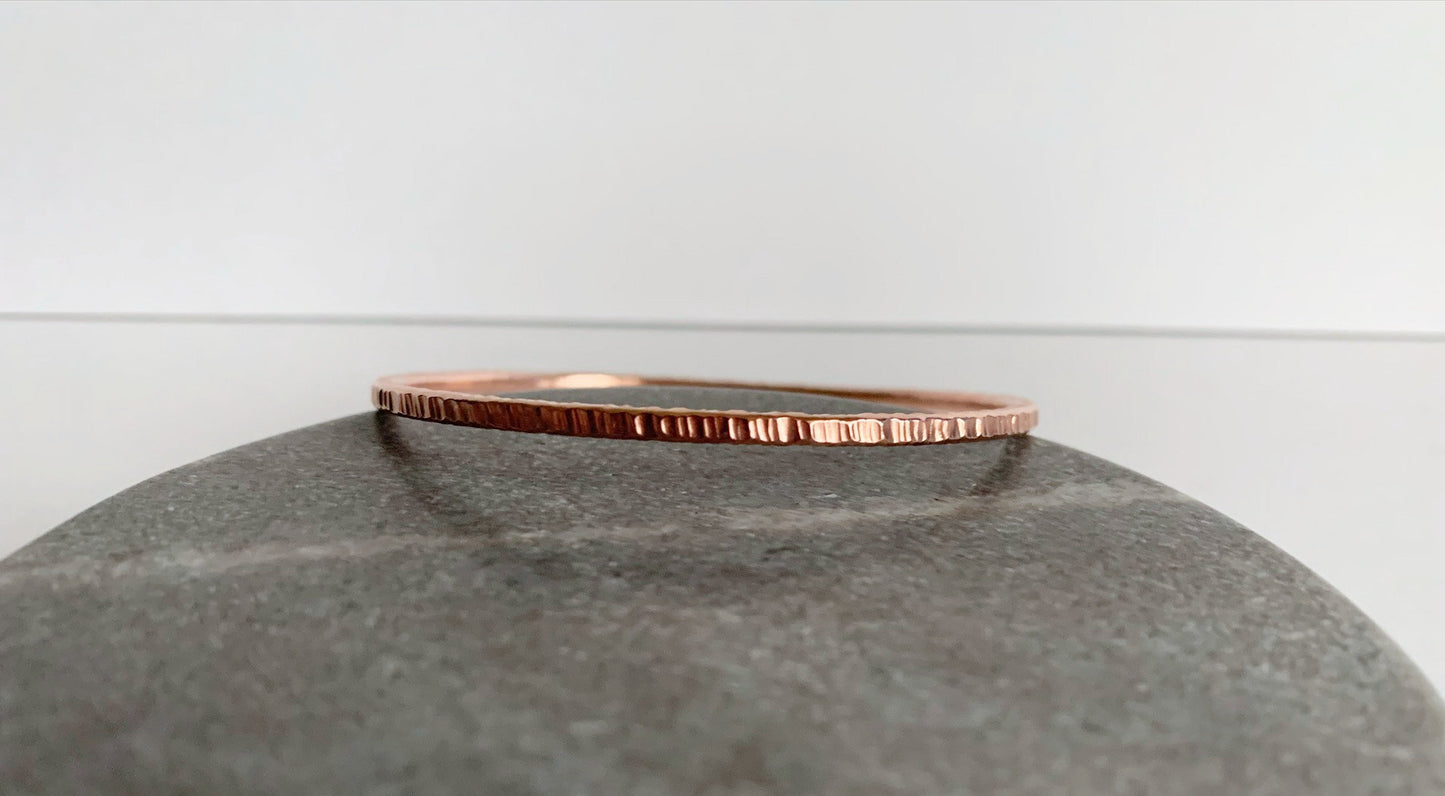 Copper bangle with heavy hammered texture