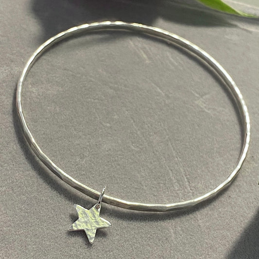Silver bangle with star charm