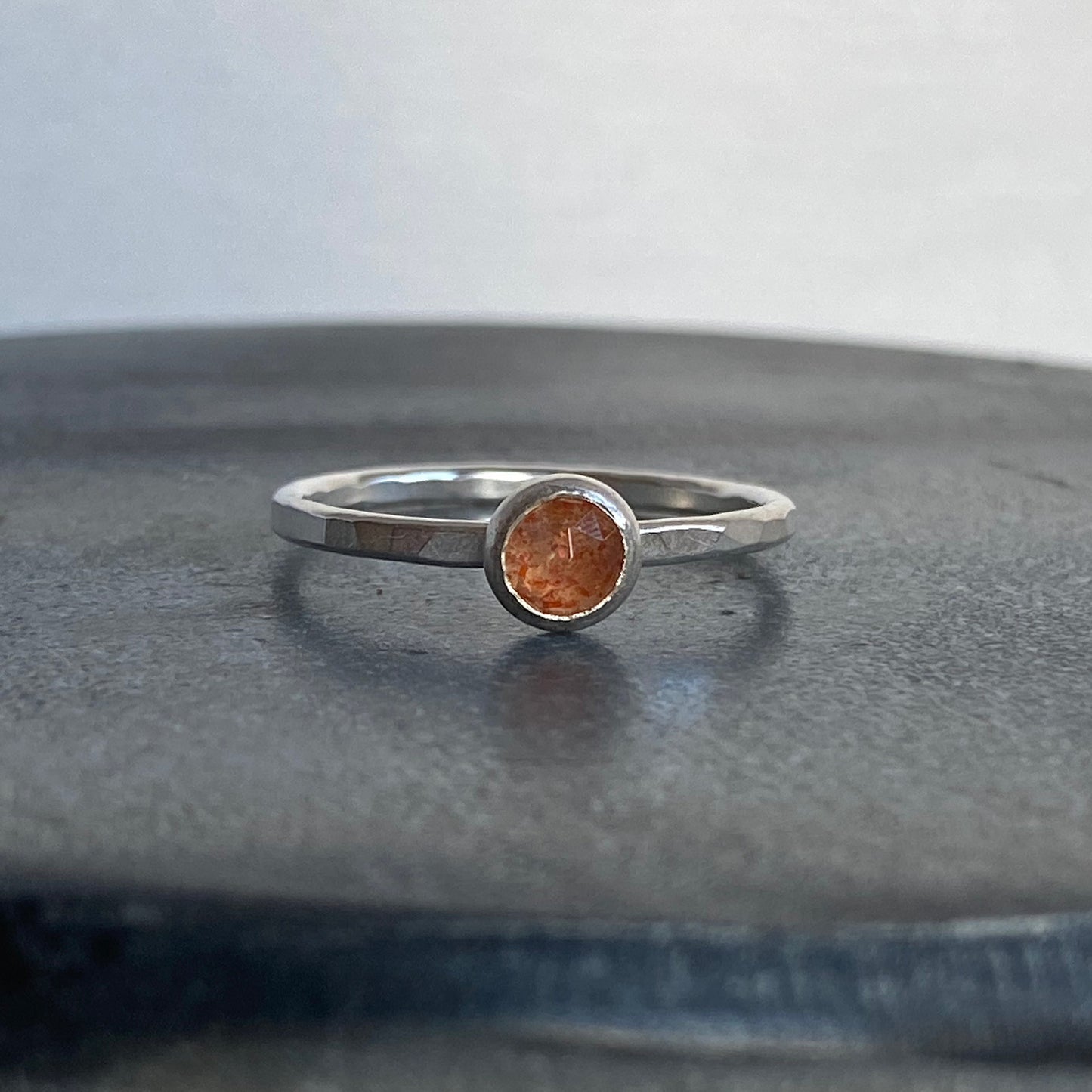 Bright orange sunstone silver ring